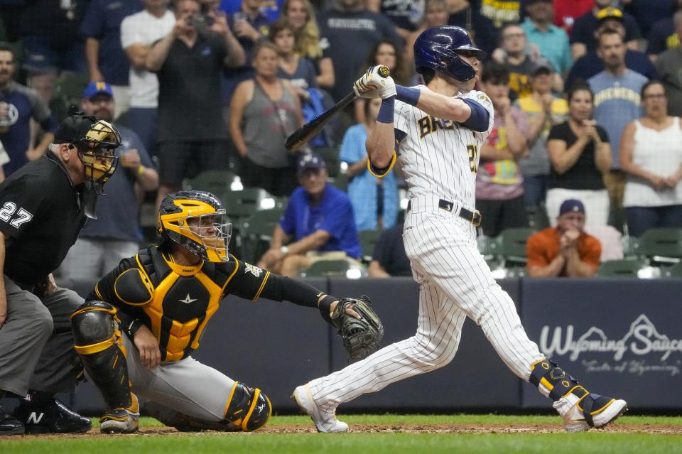 Milwaukee Brewers' Christian Yelich hits a two-run scoring double during the seventh inning of a baseball game against the Pittsburgh Pirates Friday, June 11, 2021, in Milwaukee. (AP Photo/Morry Gash)