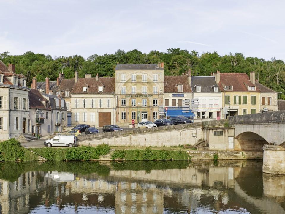 The hotel lies above a picturesque river.