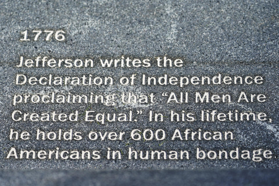 An inscriptions is shown on the wall of the Memorial to Enslaved Laborers at the University of Virginia in Charlottesville, Va., Friday Oct. 23, 2020. (AP Photo/Steve Helber)