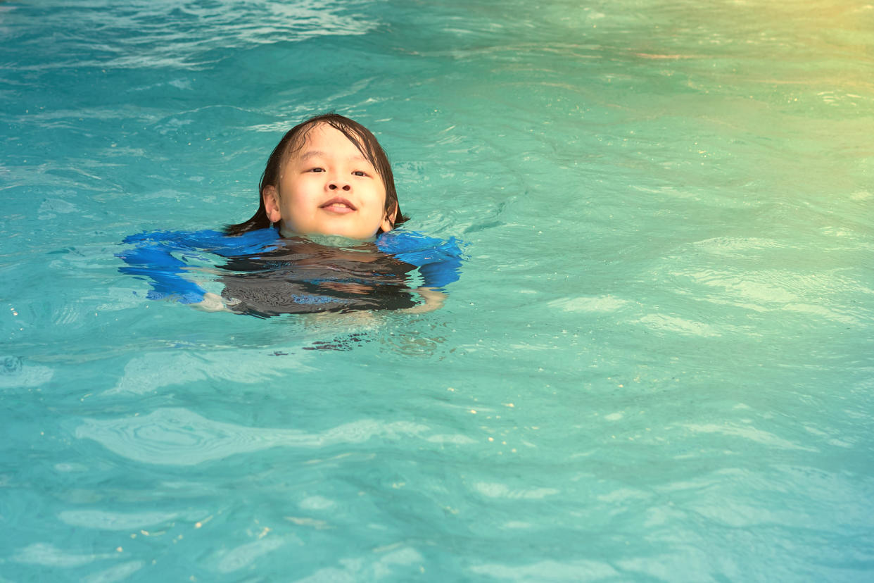 boy child float on water