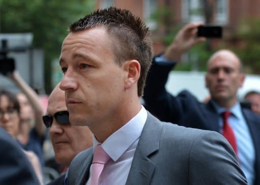 Chelsea and England footballer John Terry arrives at Westminster Magistrates court in Londonon Thursday for his trial on charges of racially abusing Anton Ferdinand during a football match last year. Terry, 31, is accused of a racially aggravated public order offence