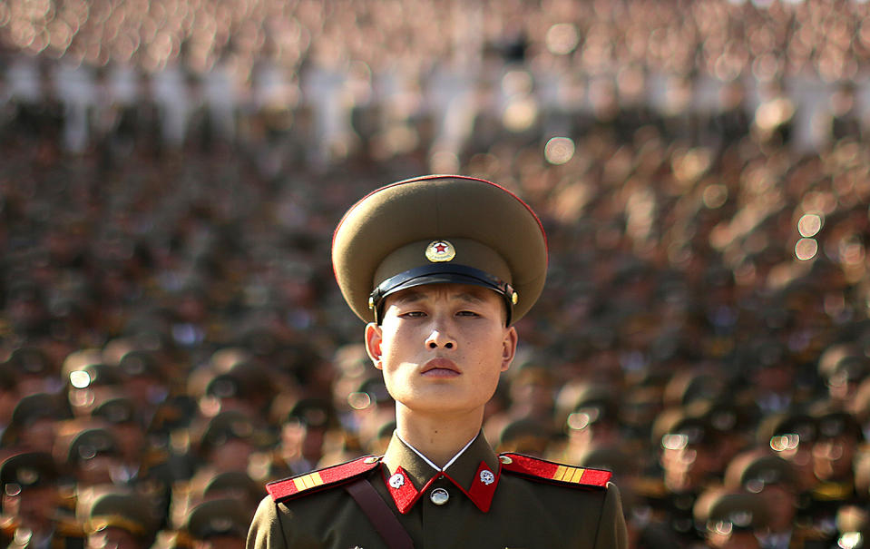 A soldier watches a military parade