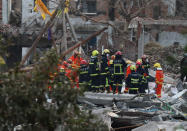 <p>Rescue workers are seen at the site of an explosion in Ningbo, China’s eastern Zhejiang province on Nov. 26, 2017. (Photo: STR/AFP/Getty Images) </p>