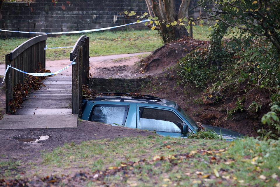 CHEW STOKE, UNITED KINGDOM - NOVEMBER 23: A car, in which a man died after being trapped in flood waters is wedged under a bridge near to a ford at Rectory Fields, in Chew Stoke, on November 23, 2012 in Somerset, England. The man died after becoming trapped in his 4x4 car in flood water last night as heavy rain continued to bring chaos to large parts of the country. (Photo by Matt Cardy/Getty Images)