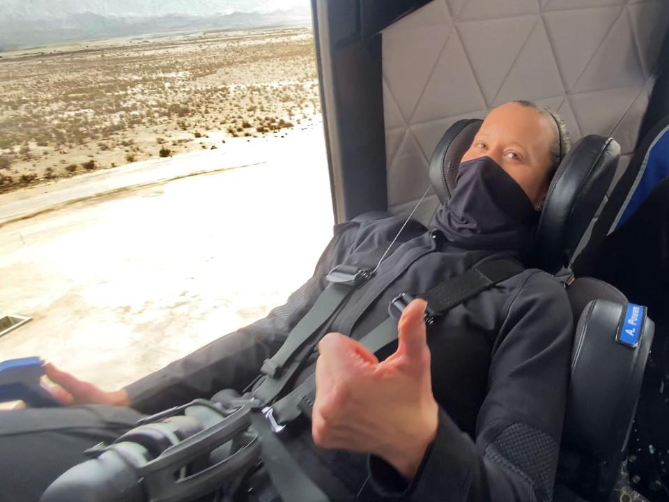 blue origin employee straps in on new shepard capsule