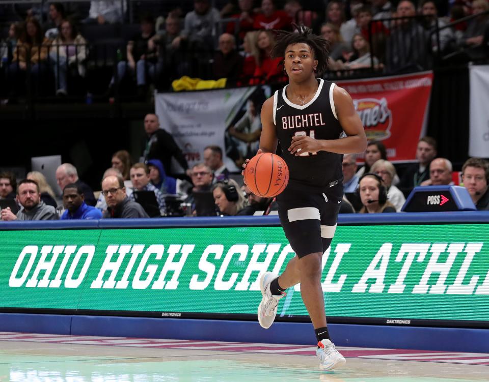 Buchtel guard Khoi Thurmon takes the ball down the court during the second half of the OHSAA Division II state final against Lutheran West, Sunday, March 19, 2023, in Dayton.