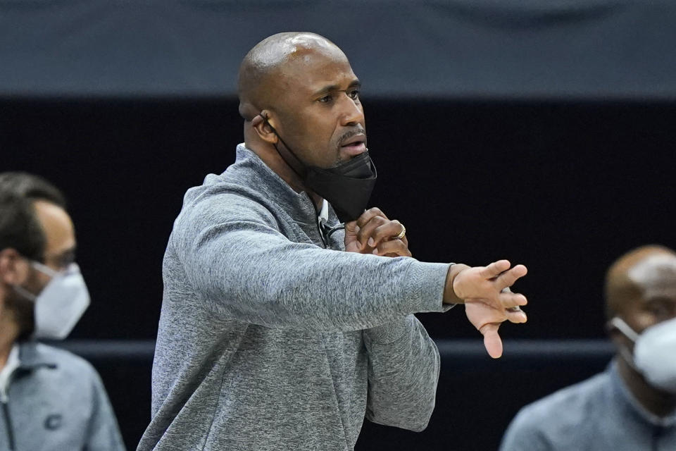 Cleveland Cavaliers assistant coach Greg Buckner gives directions to players during the second half of an NBA basketball game against the Chicago Bulls, Wednesday, April 21, 2021, in Cleveland. (AP Photo/Tony Dejak)