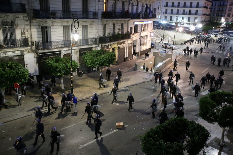 Riot police are deployed during a protest to reject the presidential election in Algiers,