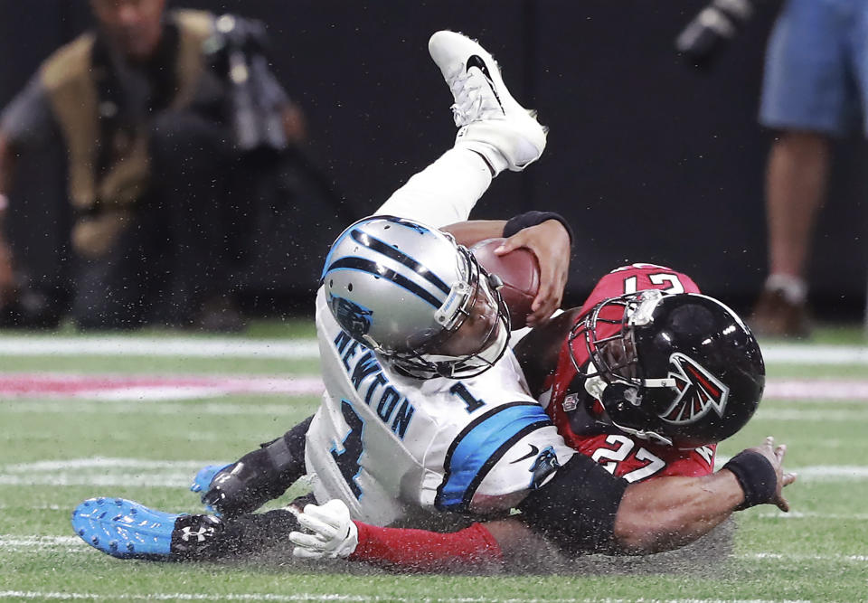 Atlanta Falcons safety Damontae Kazee (27) levels Carolina Panthers quarterback Cam Newton (1) during the second quarter of an NFL football game Sunday, Sept. 16, 2018, in Atlanta. Kazee was ejected from the game for the hit. (Curtis Compton/Atlanta Journal-Constitution via AP)