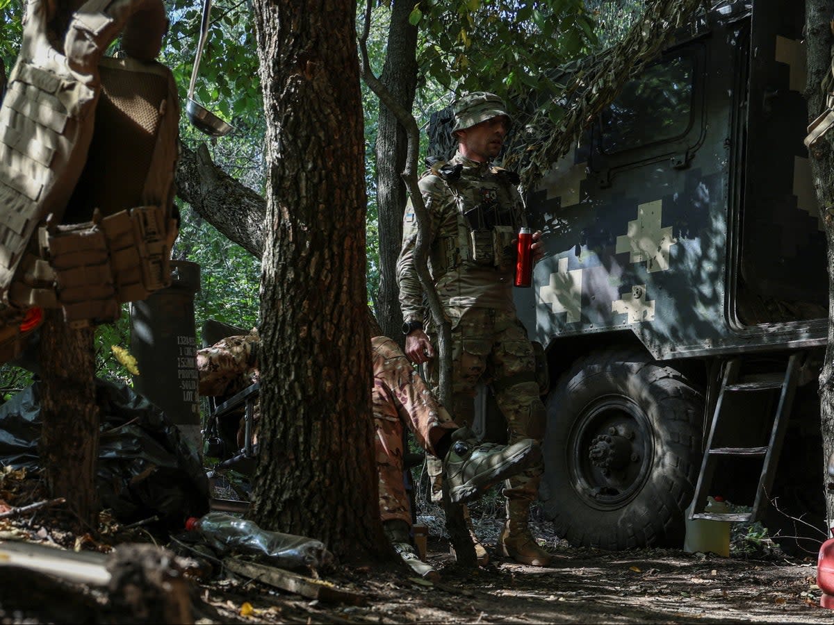 Ukrainian servicemen at a front line near the town of Bakhmut (Reuters)