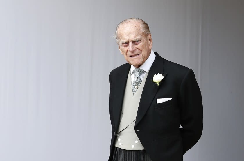 FILE - In this Friday, Oct. 12, 2018 file photo, Britain's Prince Philip waits for the bridal procession following the wedding of Princess Eugenie of York and Jack Brooksbank in St George's Chapel, Windsor Castle, near London, England. Buckingham Palace says Prince Philip has been admitted to a London hospital "as a precautionary measure." The palace said Friday, Dec. 20, 2019 that the 98-year-old husband of Queen Elizabeth II is in the King Edward VII hospital for observation and treatment of a pre-existing condition. (AP Photo/Alastair Grant, file)