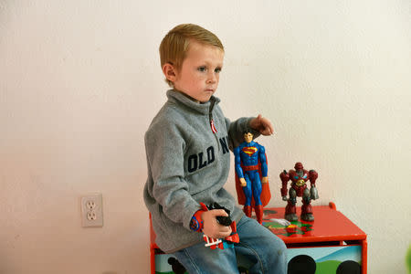 Stephanie Oakley's son, who suffers from a rare form of cancer, plays in his family's new home in Oklahoma City, Oklahoma, U.S. November 26, 2018. REUTERS/Nick Oxford