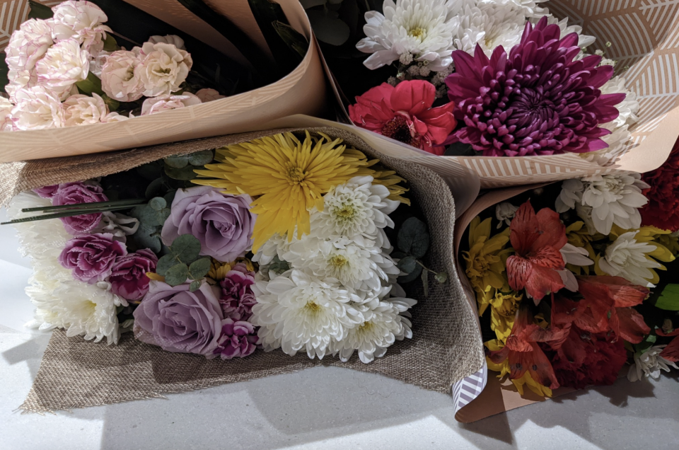 Four bouquets of bright flowers. 