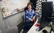 Charleen Ferguson sits in her office in Wylie, Texas, Friday, July 1, 2022. Landlords were forgiving about rent during the first two years of the pandemic, but now many are asking for back due rent. Ferguson owns the building that houses the tech business she owns with her husband, Just Call the I.T. Guy and also has 13 tenants, so she sees the dilemma from both the small business and landlord points of view. (AP Photo/LM Otero)