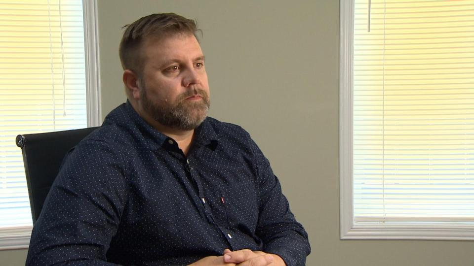 Nunavut Teachers' Association President Justin Matchett sits for an interview with CBC News in August 2023