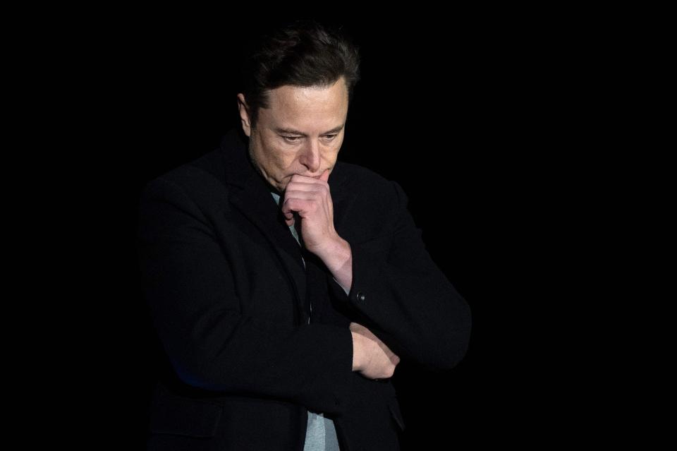 Elon Musk pauses and looks down as he speaks during a press conference at SpaceX's Starbase facility near Boca Chica Village in South Texas in February.