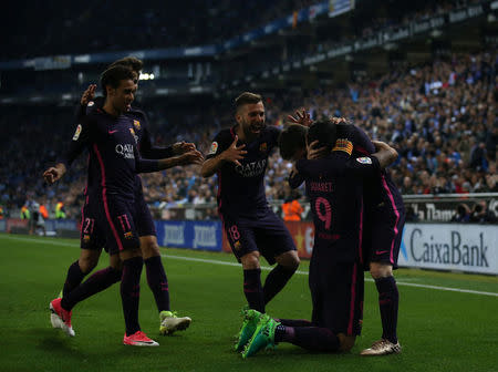 Soccer Football - Espanyol v Barcelona - Spanish La Liga Santander - RCDE stadium, in Cornella-El Prat (Barcelona), Spain - 29/04/2017. Barcelona's players celebrate a goal. REUTERS/Albert Gea