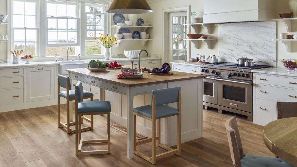 19th century farm in block island, rhode island designed by miles redd and gil schafer kitchen the island countertop is crafted of pippy oak, and the range is by wolf