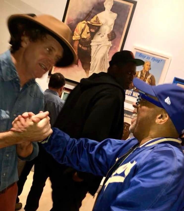 Artist Scott "Panhandle Slim" Stanton meets director Spike Lee at a Brooklyn Museum exhibition opening.