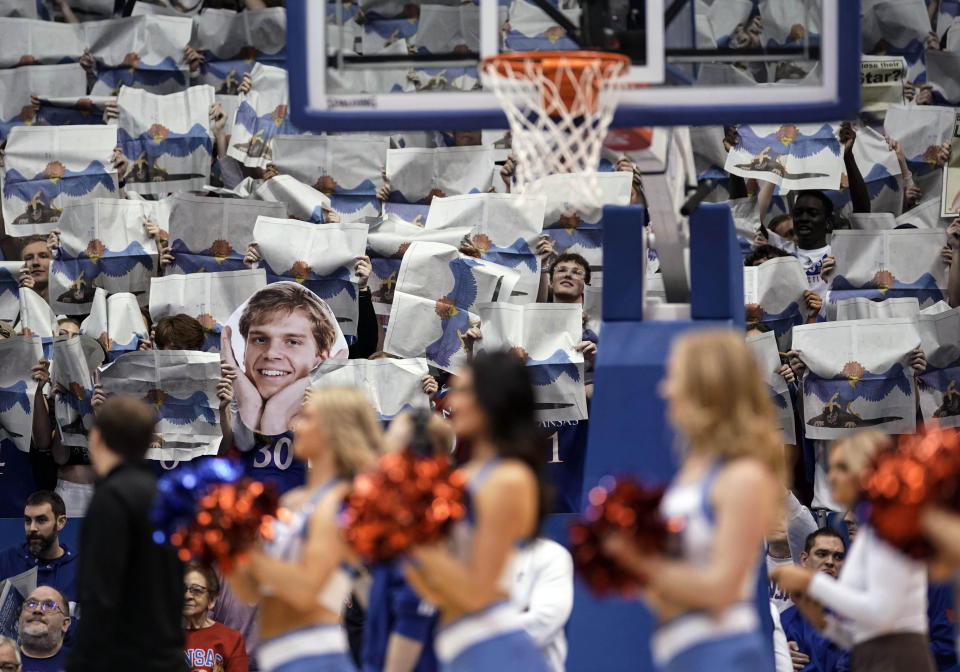 The face of Kansas guard Gradey Dick (4) floats through the student section during the pregame player introductions during an NCAA college basketball game between Kansas and West Virginia on Saturday, Feb. 25, 2023, at Allen Fieldhouse in Lawrence, Kan. (AP Photo/Nick Krug)