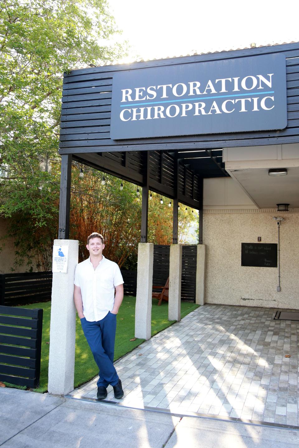 Chiropractor Kaleb Scroggin in his office at Restoration Chiropractic.