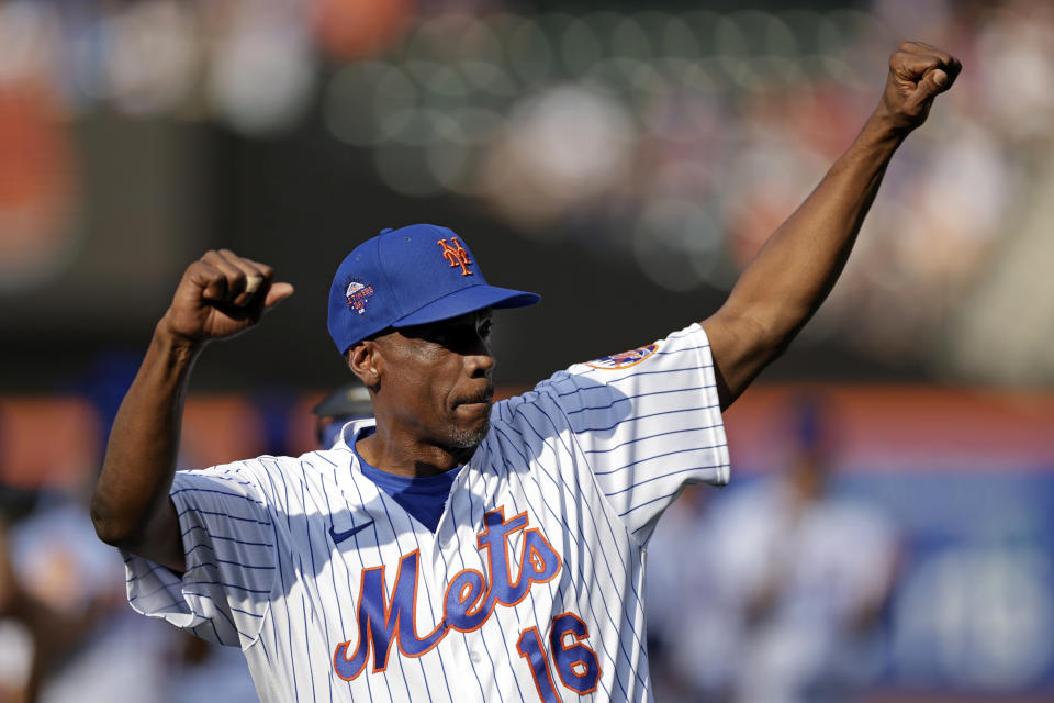 FILE - Former New York Mets' Dwight Gooden during Old-Timers' Day ceremony before a baseball game between the Colorado Rockies and the New York Mets on Saturday, Aug. 27, 2022, in New York. Dwight Gooden’s No. 16 and Darryl Strawberry’s No. 18 will be retired by the New York Mets in separate pregame ceremonies next year honoring players who were keys to the team’s last World Series title in 1986.(AP Photo/Adam Hunger, File)