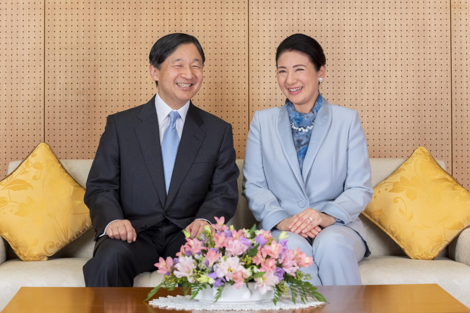 In this Feb. 12, 2020, photo released by Imperial Household Agency of Japan, Japan's Emperor Naruhito and his wife Empress Masako smile at their residence in Tokyo, ahead of his 60th birthday on Sunday, Feb. 23, 2020. Naruhito offered his sympathy to those affected by the new virus that emerged in China and said he hopes to see the outbreak contained soon. Birthday celebration plans had called for him to wave from the palace balcony to tens of thousands of well-wishers, but they were canceled as a precautionary anti-infection measure. (Imperial Household Agency of Japan via AP)