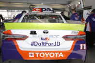 Denny Hamlin will honor JD Gibbs with a hashtag painted on his car for a NASCAR Cup Series auto race on Saturday, Nov. 16, 2019, at Homestead-Miami Speedway in Homestead, Fla. Gibbs past away earlier this year. (AP Photo/Terry Renna)
