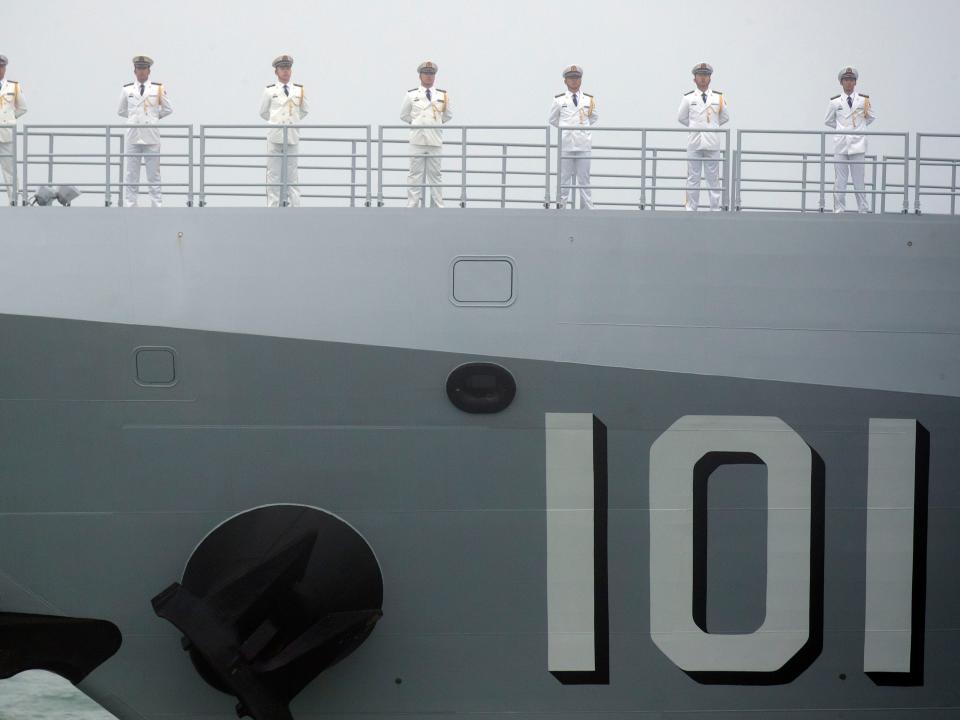 Sailors stand on the deck of the new type 055 guide missile destroyer Nanchang of the Chinese People's Liberation Army (PLA) Navy in April 2019.