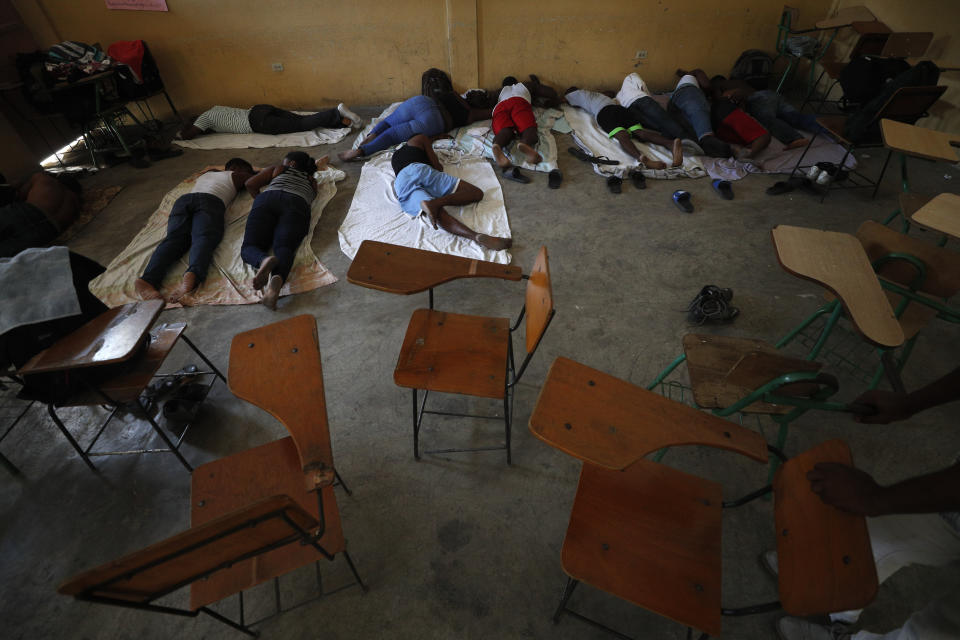 A group of 16 students at Haiti's State University, who didn't want their identities revealed to protect their safety, rest in a classroom on day three of a hunger strike calling for the resignation of President Jovenel Moïse and protesting against insecurity, inflation, corruption, and other societal ills, in Port-au-Prince, Haiti, Tuesday, Oct. 15, 2019. Haiti's embattled president faced a fifth week of protests as road blocks and marches continue across the country, after opposition leaders said they will not back down on their call for Moïse to resign. (AP Photo/Rebecca Blackwell)