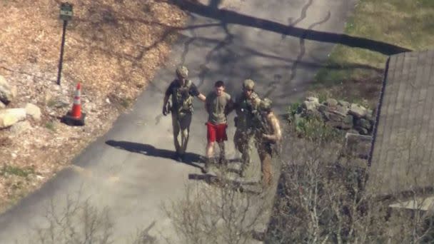 PHOTO: Suspected classified document leaker and U.S National Guardsman, Jack Teixeira, is taken into custody by FBI agents in North Dighton, Mass., April 13, 2023. (WCVB)