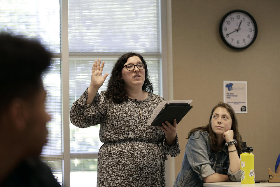 In this photo taken Tuesday, May 21, 2019, social sciences teacher Kasey Turcol teaches her 11th grade students about the D-Day invasion at Normandy during an advanced placement history class at Crossroads FLEX school in Cary, N.C. Turcol has just 75 minutes to explain to her high school students the importance of D-Day - and if this wasn’t the 75th anniversary of the turning point in World War II, she wouldn’t devote that much time to it. (AP Photo/Gerry Broome)