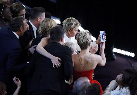 Host Ellen Degeneres takes a group picture at the 86th Academy Awards in Hollywood, California March 2, 2014. REUTERS/Lucy Nicholson