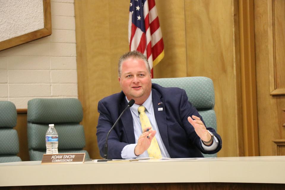 Adam Snow speaks during a commission meeting in this Spectrum file photo. Snow, a Republican who last year was appointed to replace the late Dean Cox on the commission, was ahead in the special election for the seat being held in this 2022 midterm election.