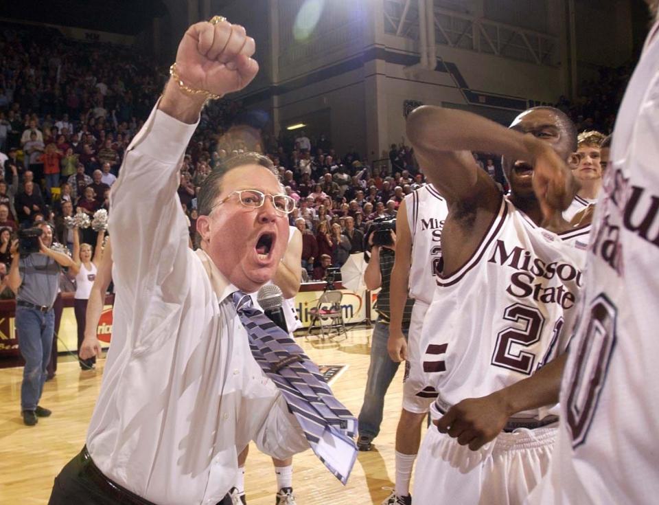 Missouri State coach Barry Hinson, left, and senior guard Deke Thompson, right, celebrate their victory over Houston in an NIT basketball game Monday, March 20, 2006, in Springfield, Mo.