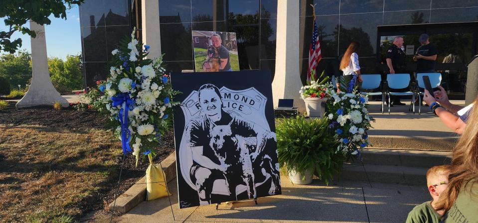 A memorial is set up at the prayer vigil in honor of fallen RPD K9 Officer Seara Burton in front of the Richmond Municipal Building Sept. 8, 2023, nearly a year after her death.