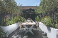 <p> A great way to add impact and frame even small backyards is to keep your garden room central to surrounding raised garden borders. This will help create a refined and inviting structure outdoors. Having the outdoor table almost extending out from the garden room opening gives this fairly small space the perfect amount of drama. </p>