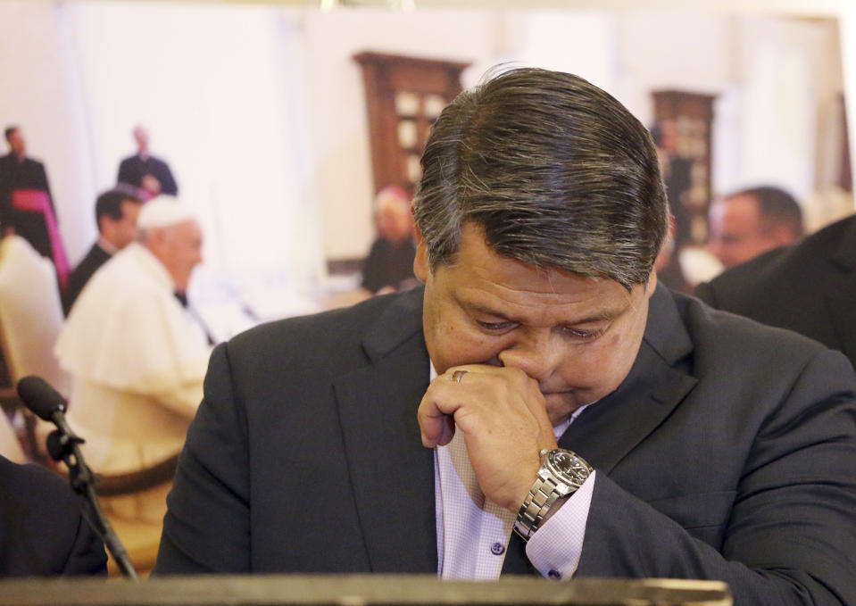 Manuel Vega, who says he was sexually abused by a priest over a five-year period decades ago, pauses as he talks about his lawsuit against the Vatican, seeking the names of all offenders within the church worldwide, at a news conference in Los Angeles Thursday, Oct. 4, 2018. Vega, now 52, reached a settlement with the Archdiocese of Los Angeles in 2007, but his attorneys said Thursday that doesn't release the Vatican from responsibility. The lawsuit, filed Wednesday, Oct. 3 in federal court in California, accuses the Vatican of placing the Rev. Fidencio Silva-Flores in a position of power at Our Lady of Guadalupe Church in Oxnard, Calif., and says it should have known he posed a danger to children. (AP Photo/Reed Saxon)