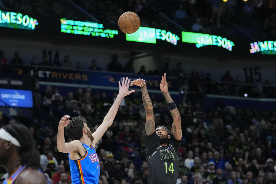 New Orleans Pelicans forward Brandon Ingram (14) shoots against Oklahoma City Thunder forward Chet Holmgren in the first half of Game 4 of an NBA basketball first-round playoff series in New Orleans, Monday, April 29, 2024. (AP Photo/Gerald Herbert)