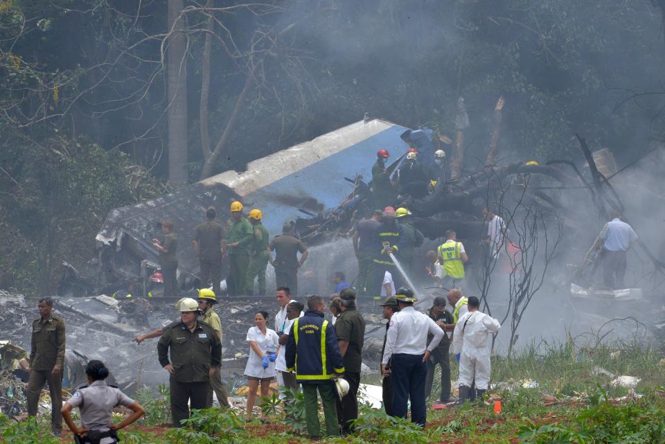 <p>Picture taken at the scene of the accident after a Cubana de Aviacion aircraft crashed after taking off from Havana’s Jose Marti airport on May 18, 2018. – A Cuban state airways passenger plane with 104 passengers on board crashed on shortly after taking off from Havana’s airport, state media reported. The Boeing 737 operated by Cubana de Aviacion crashed “near the international airport,” state agency Prensa Latina reported. Airport sources said the jetliner was heading from the capital to the eastern city of Holguin. (Photo: Adalberto Roque/AFP/Getty Images) </p>