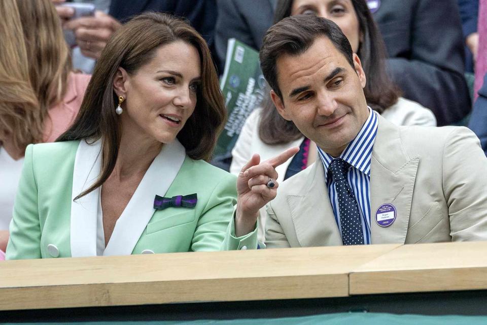 <p>Tim Clayton/Corbis via Getty Images</p> Kate Middleton and Roger Federer watch Wimbledon on July 4.