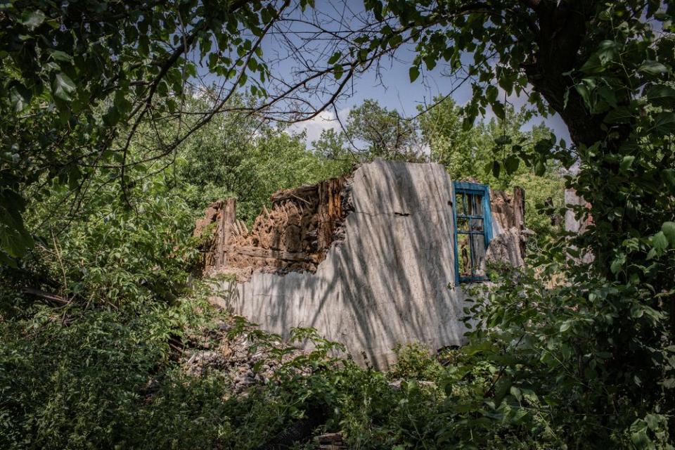 A house that was destroyed by shelling in Yuzhnaya, a frontline area near Toretsk. It's easy for outsiders to see only broken walls, collapsed ceilings and a mess of the mutilated furniture and wallpaper. Yet locals still see their homes, and carry stories about the lives they lived in them.