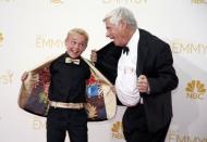 Mason Vale Cotton (L) and Robert Morse from the AMC drama series "Mad Men" show off their coat linings as they arrive at the 66th Primetime Emmy Awards in Los Angeles, California August 25, 2014. REUTERS/Lucy Nicholson