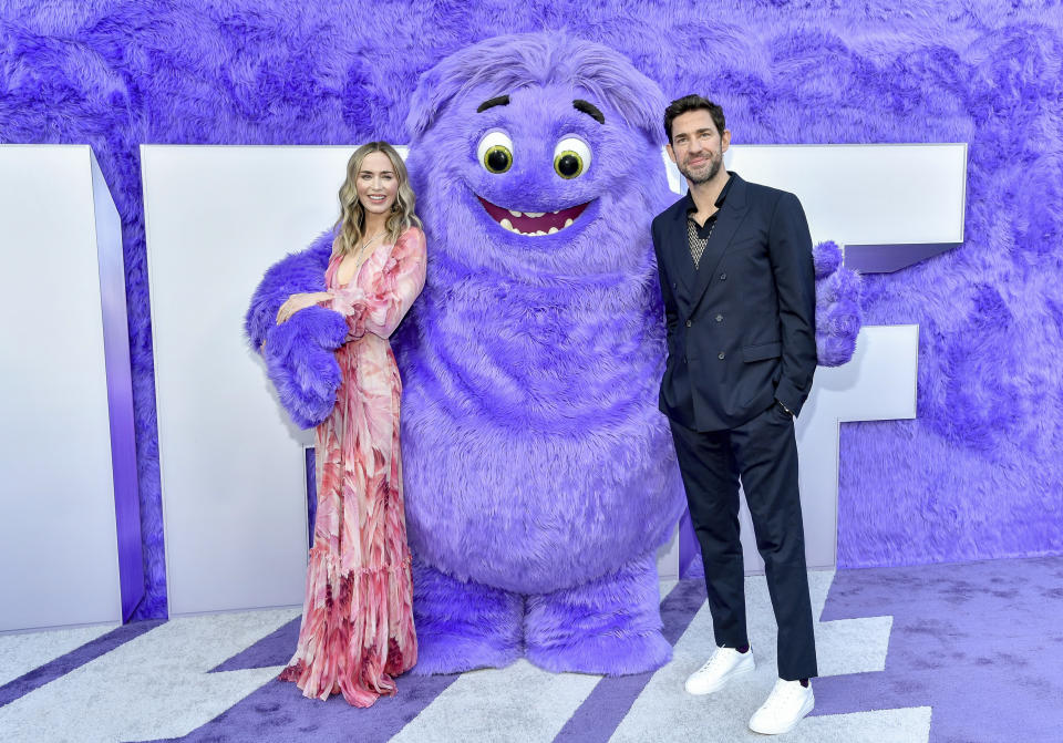 Emily Blunt, left, and John Krasinski pose with the character "Blue" at the premiere of Paramount Pictures' "IF" at the SVA Theatre on Monday, May 13, 2024, in New York. (Photo by Evan Agostini/Invision/AP)