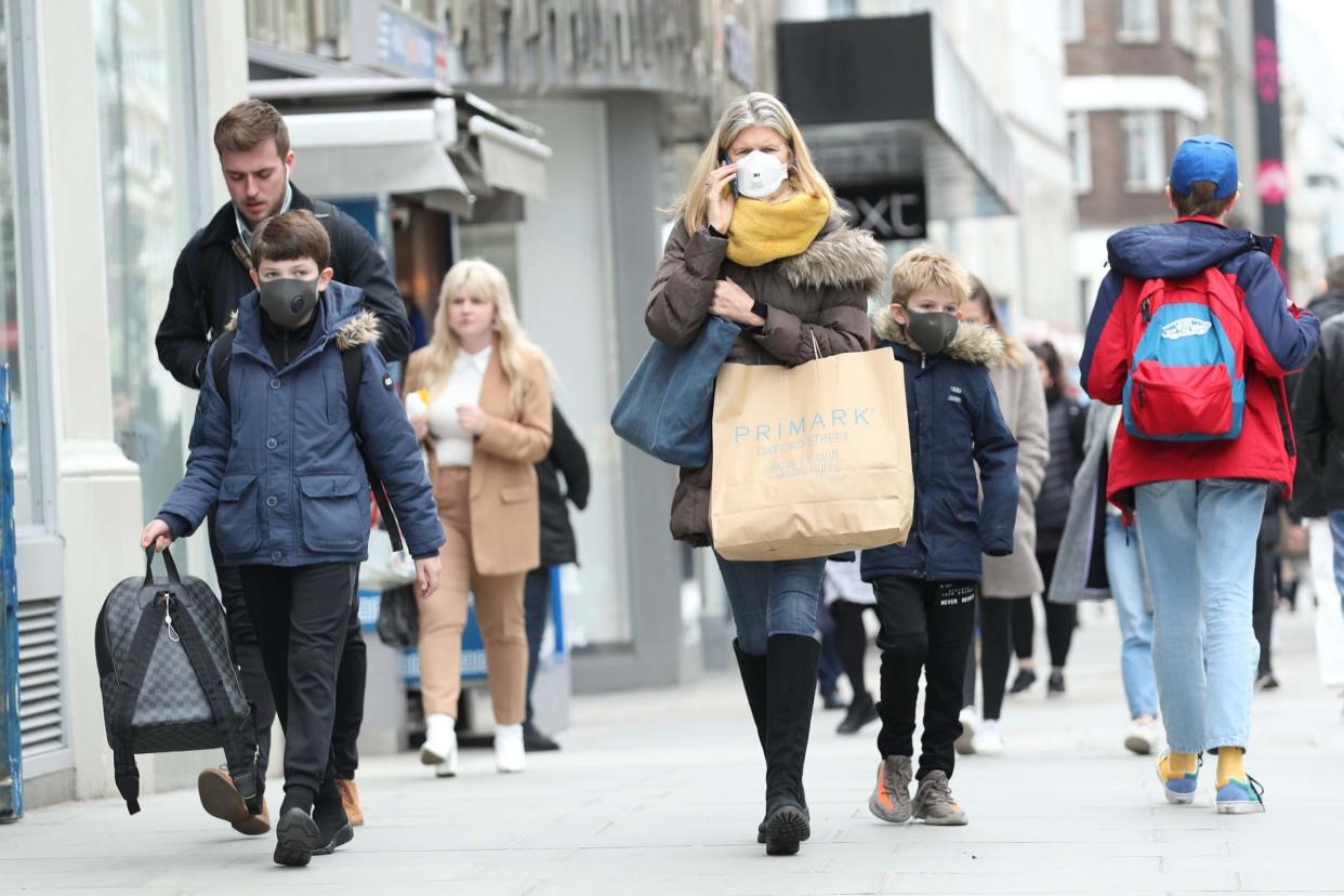 People are seen wearing protective face mask in Oxford Street London. It comes as Sage members warn restrictions may need to be in place for six months: PA