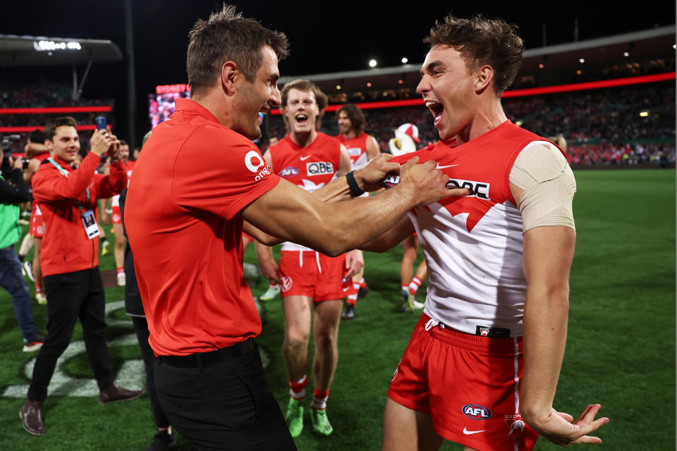 Josh P. Kennedy embraces Ryan Clarke as the Sydney Swans celebrate victory against Collingwood.