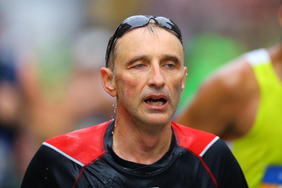 <p>A runner looks like he is feeling the pain during during the 2017 New York City Marathon, Nov. 5, 2017. (Photo: Gordon Donovan/Yahoo News) </p>