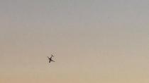 A Horizon Air Bombardier Dash 8 Q400, reported to be hijacked, flies over University Place, Washington, the U.S., before crashing in the South Puget Sound, August 10, 2018 in this still image taken from a video obtained from social media. John Waldron/via REUTERS