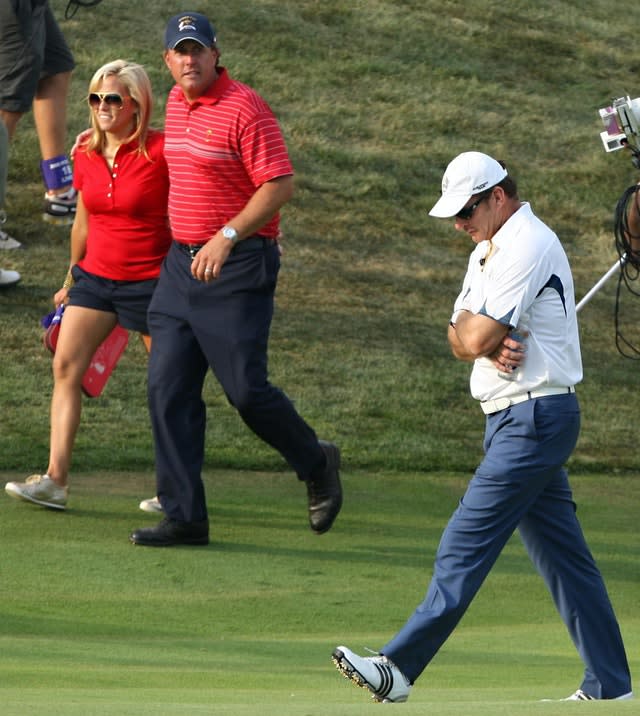 Nick Faldo, right, looks dejected after accepting defeat