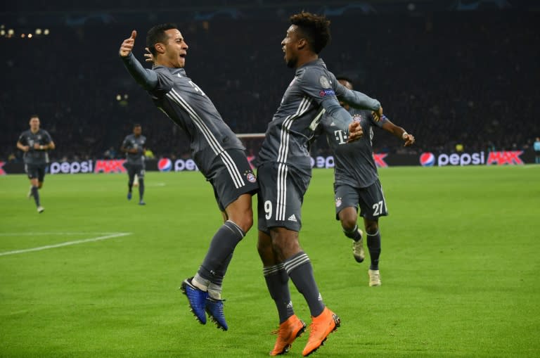 Bayern Munich's Kingsley Coman (R) celebrates with Thiago Alcantara (L) after the former scored against Ajax in the Champions League on Wednesday